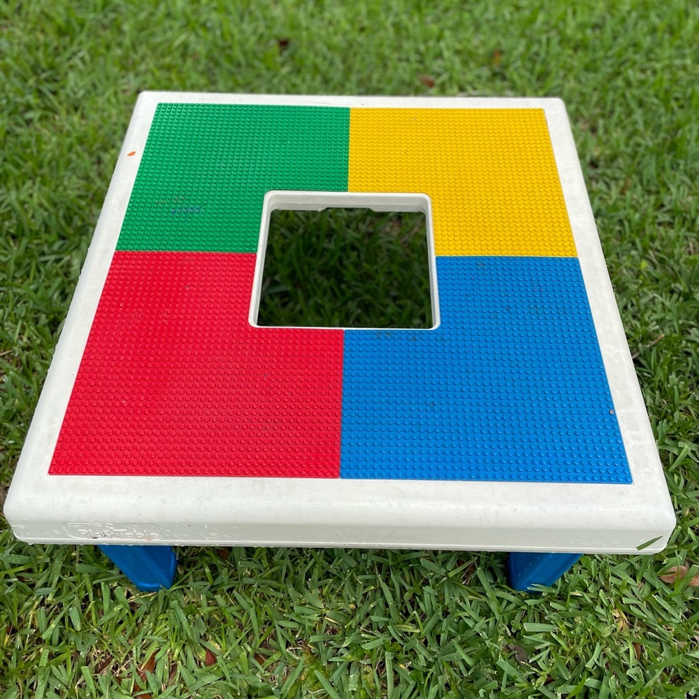 Lego table with a basket of big legos